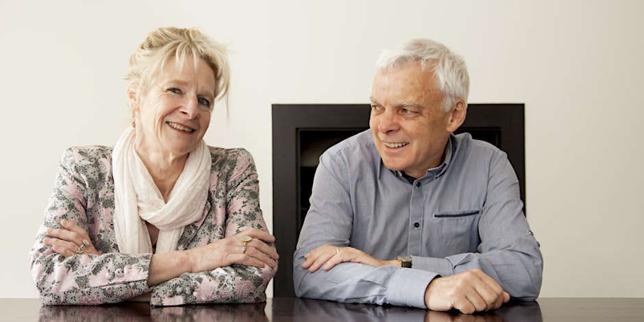 Literary couple Anne Buist and Graeme Simsion sit at a table
