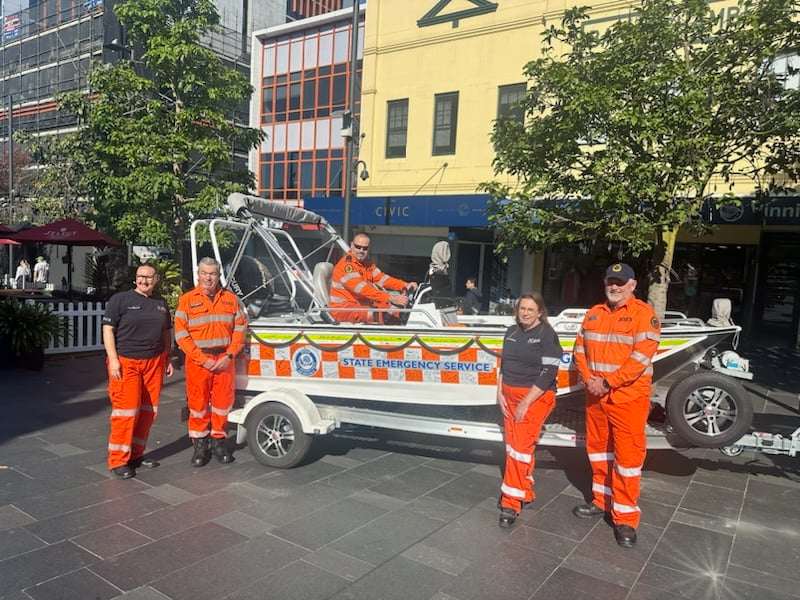 SES volunteers with a boat on a trailer