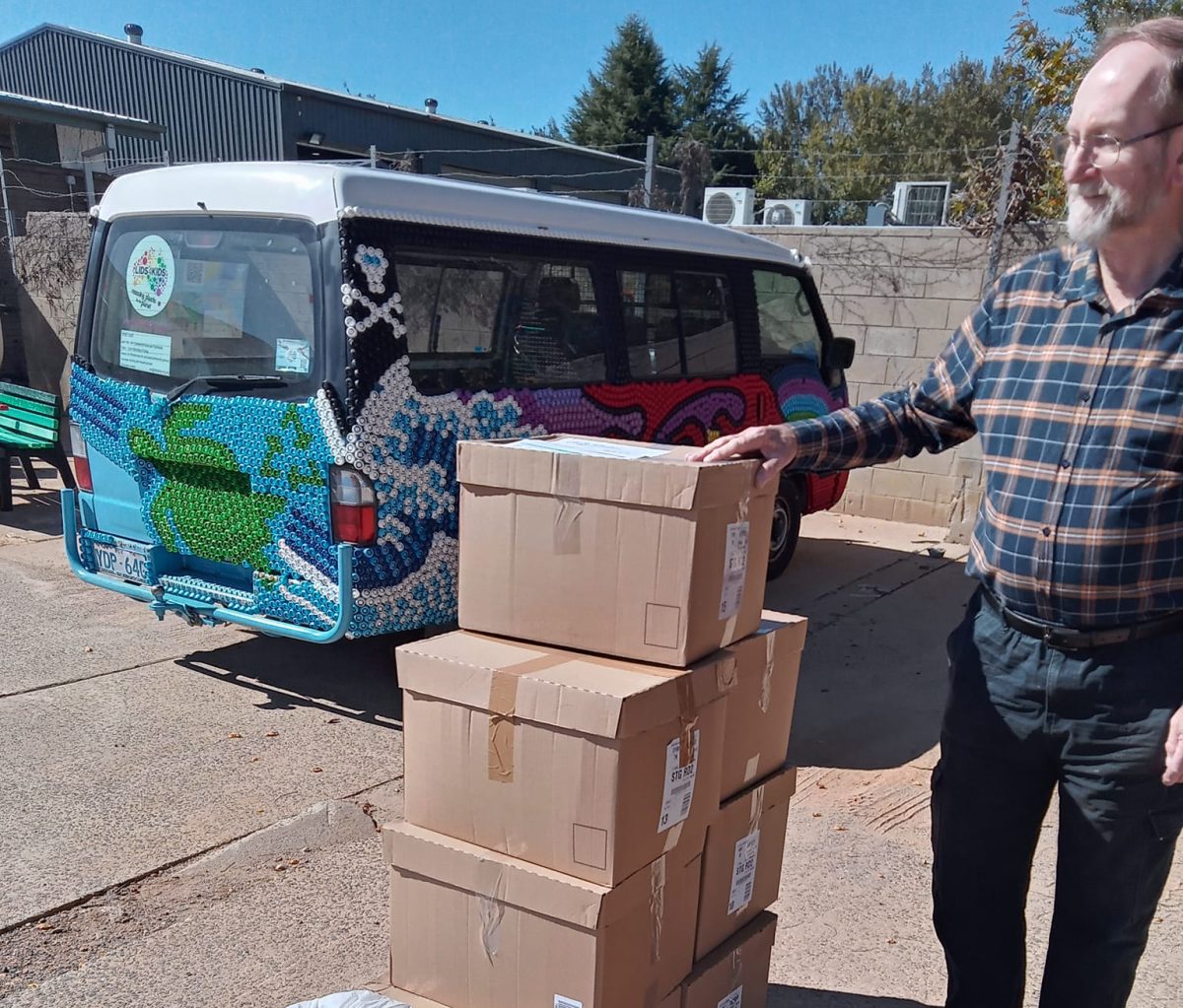 Kiama resident Peter Maywald stands next to boxes of plastic lids bound for Lids4Kids depot in Canberra