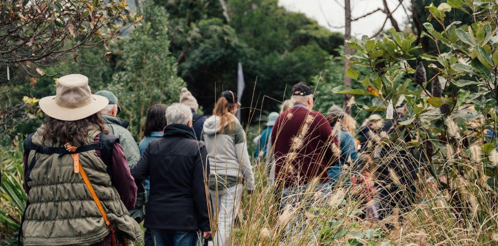 People walk through Wollongong Botanic Garden
