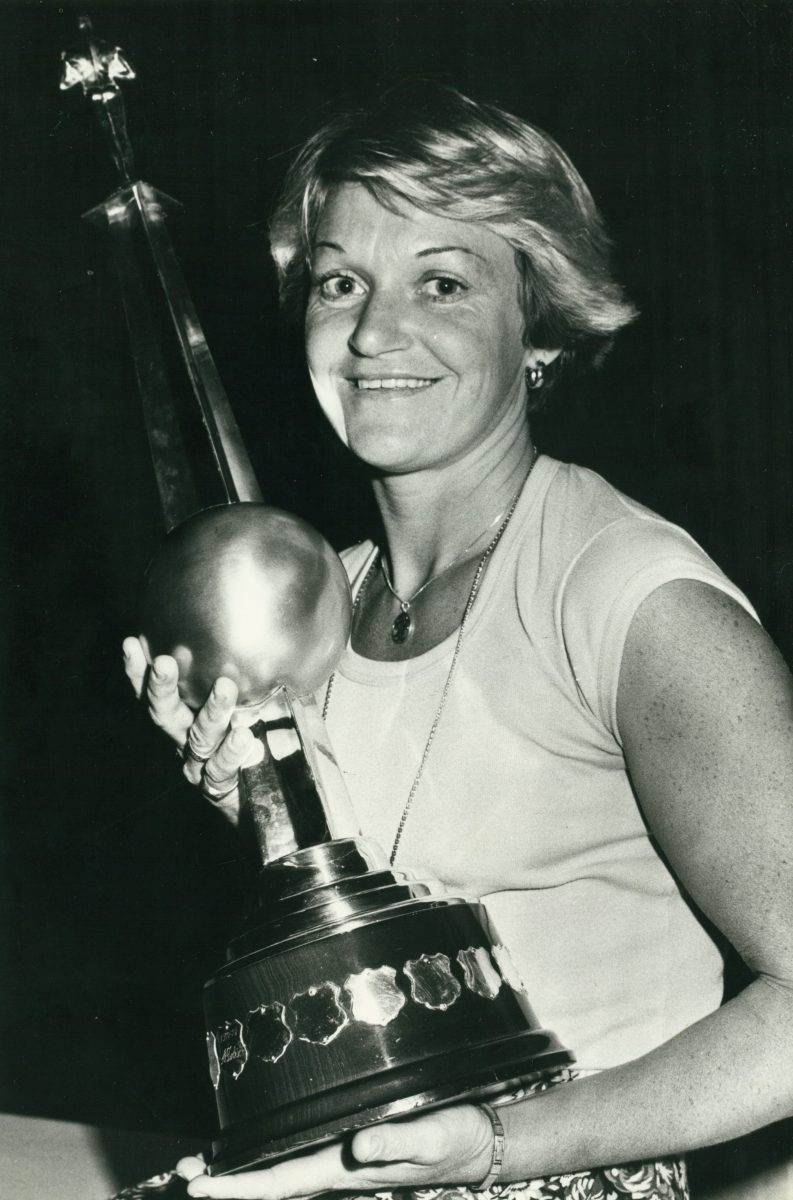 Dianne Gorman holding a trophy.