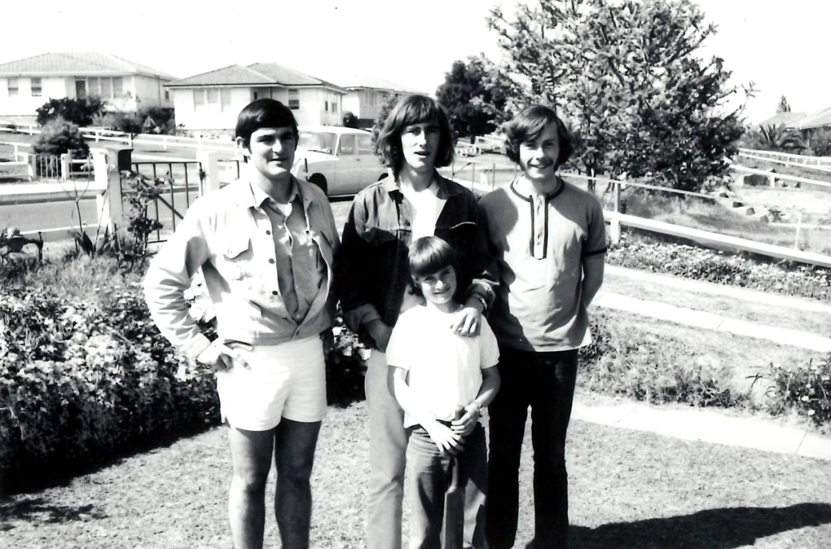 Black and white photo of four people.