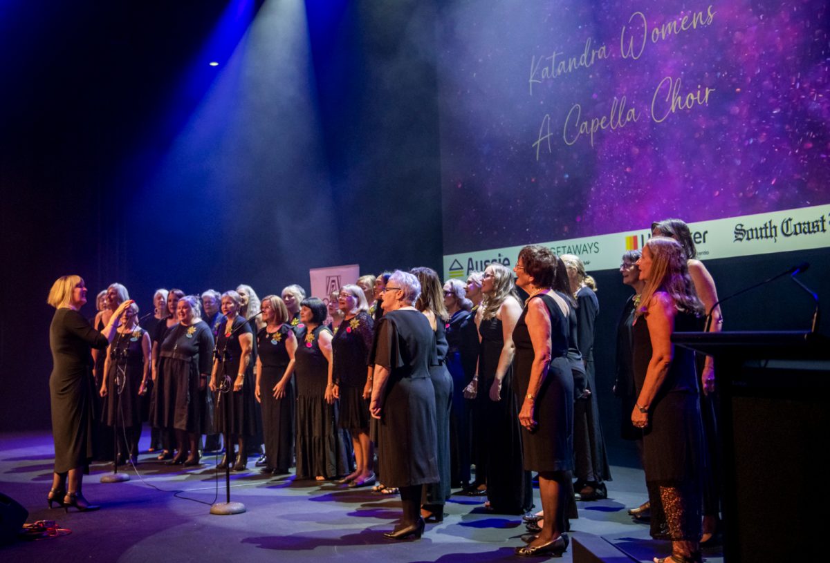 Women’s a cappella choir performing on stage