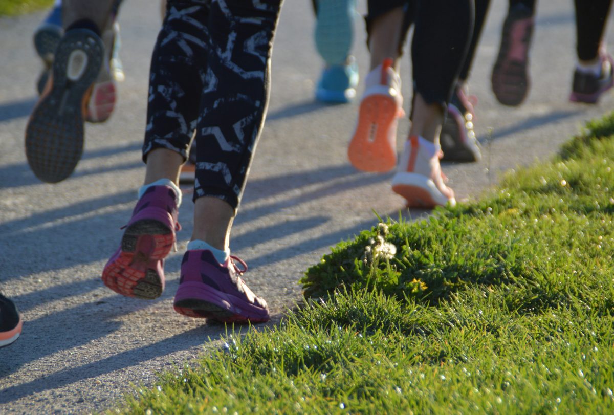 Close up of feet of group of people running