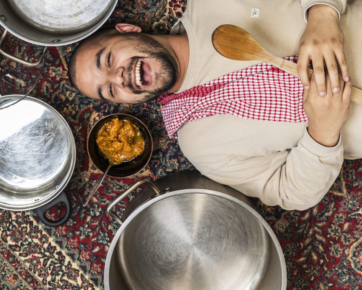 Wollongong theatre producer and actor Josh Hinton next to pots and pans