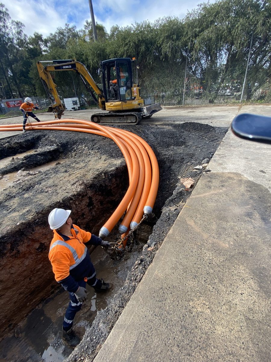 Workers laying pipes.