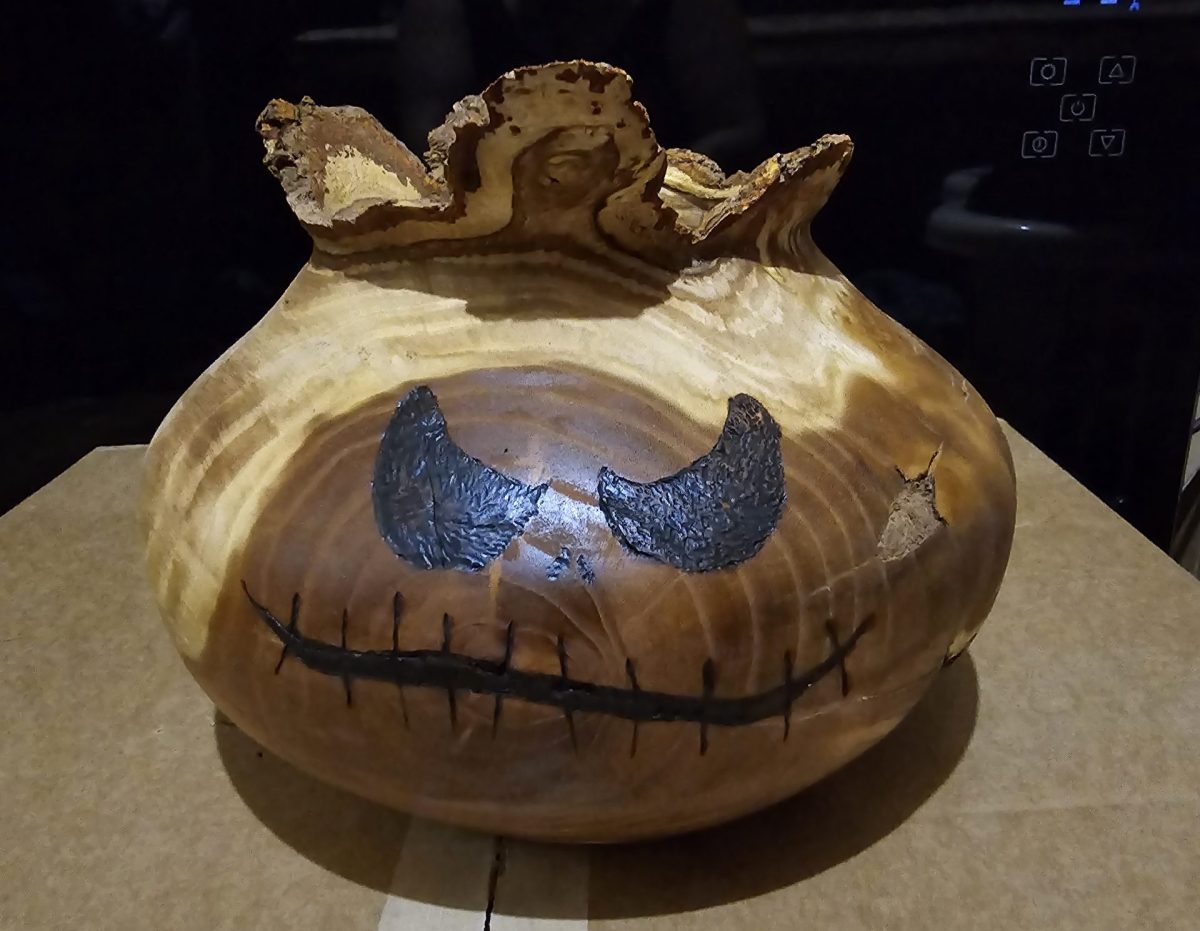 Halloween pumpkin made out of wood.