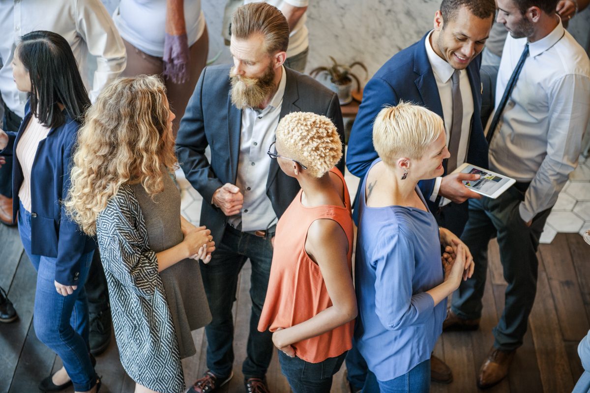 People mingle at a networking event