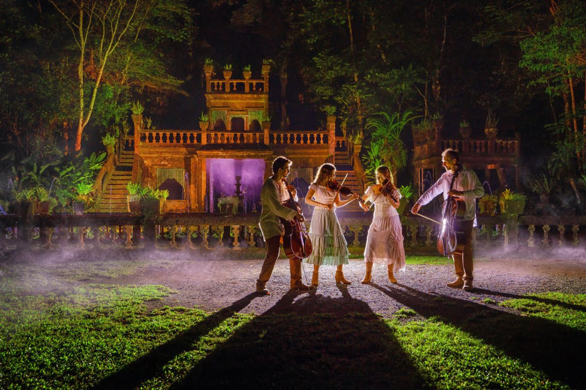 family performing with string instruments