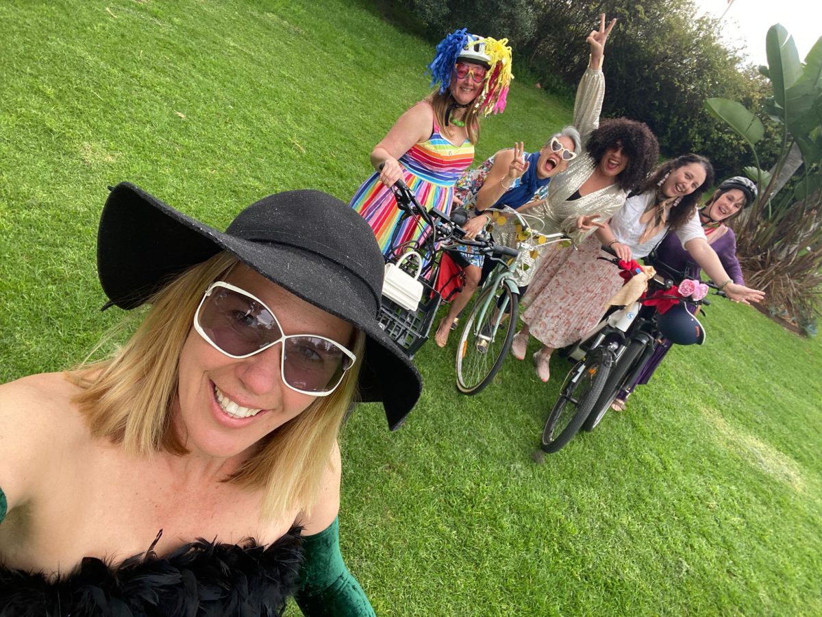 Women dressed fancy on bikes