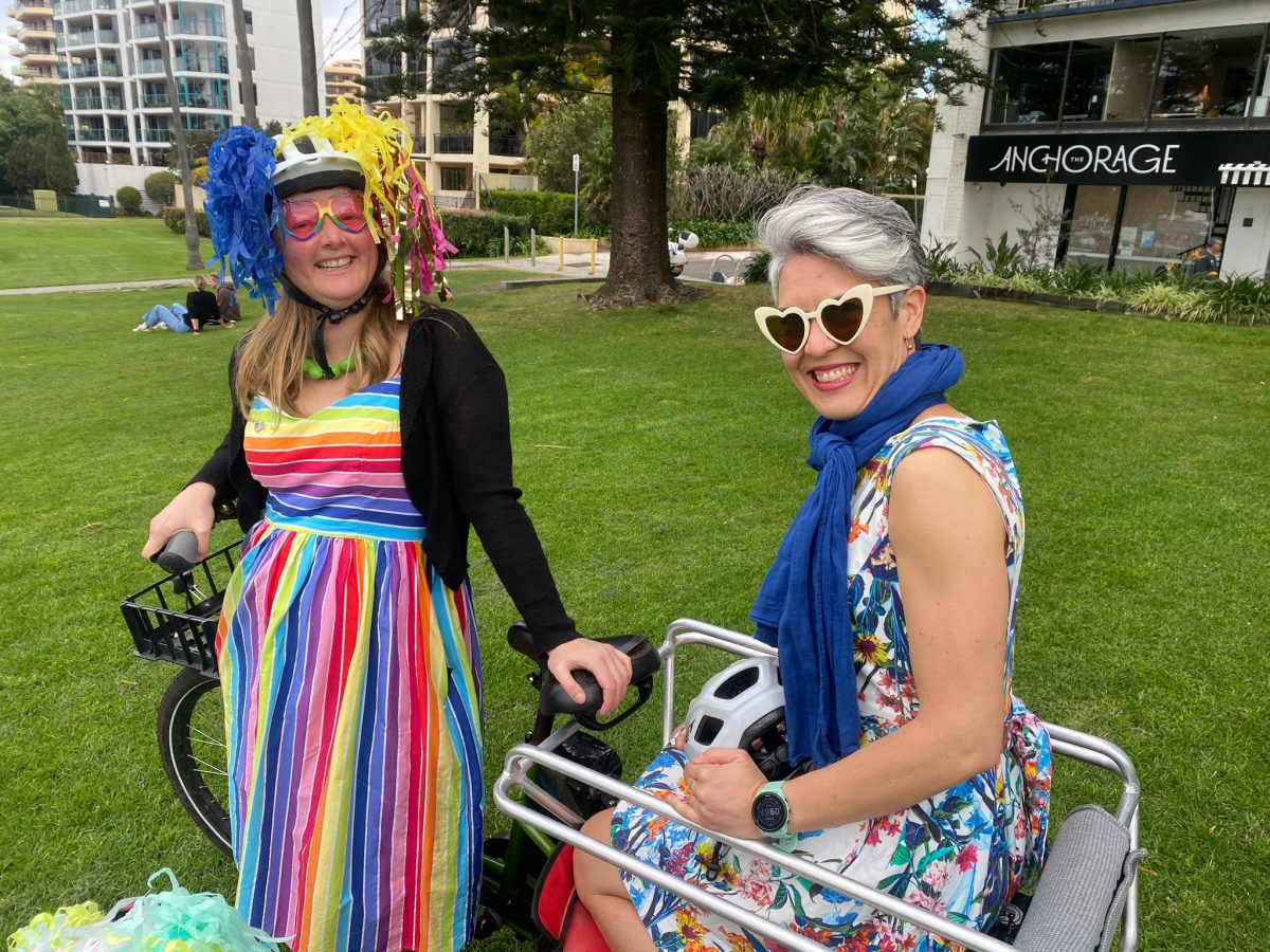 Women dressed fancy on bikes