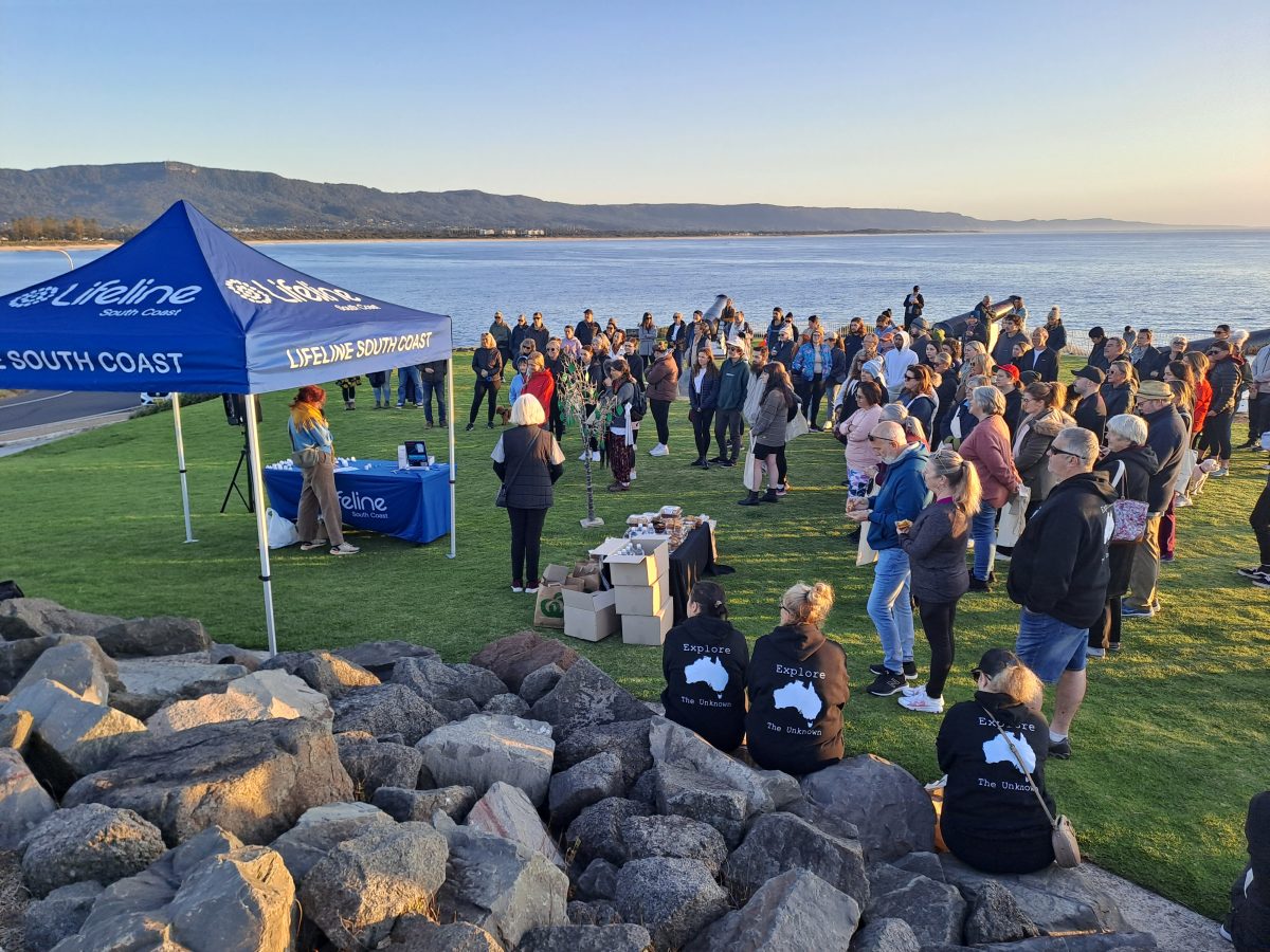 People gather on the coast for Lifeline's Out of the Shadows Walk