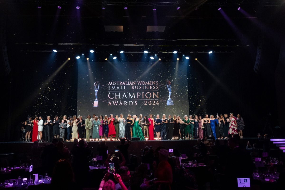 Group shot of winners on stage at business award presentations