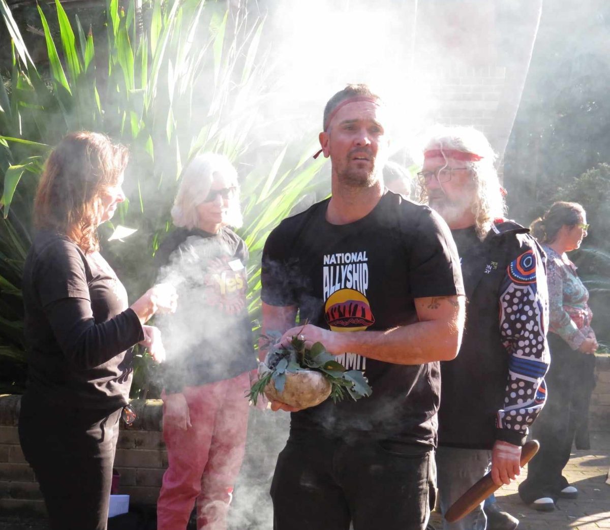 Jerrinja-Yuin man Peter Hewitt, and Awabakal, Gomeroi and Yuin man Dr Anthony McKnight conduct a smoking ceremony