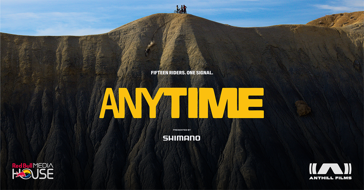 Poster for Anytime featuring bikers standing on a high mountain and one riding down