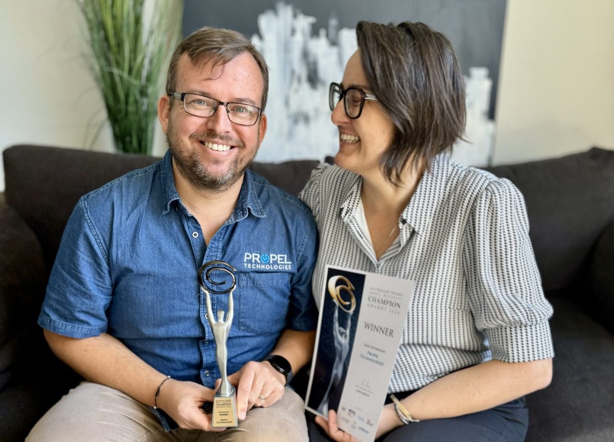 a man and a woman with a business award