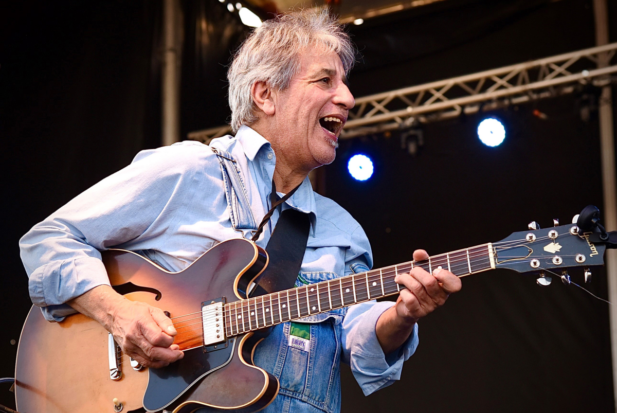 Chris Cain playing guitar on stage