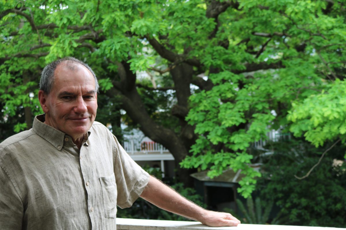 Man in front of tree