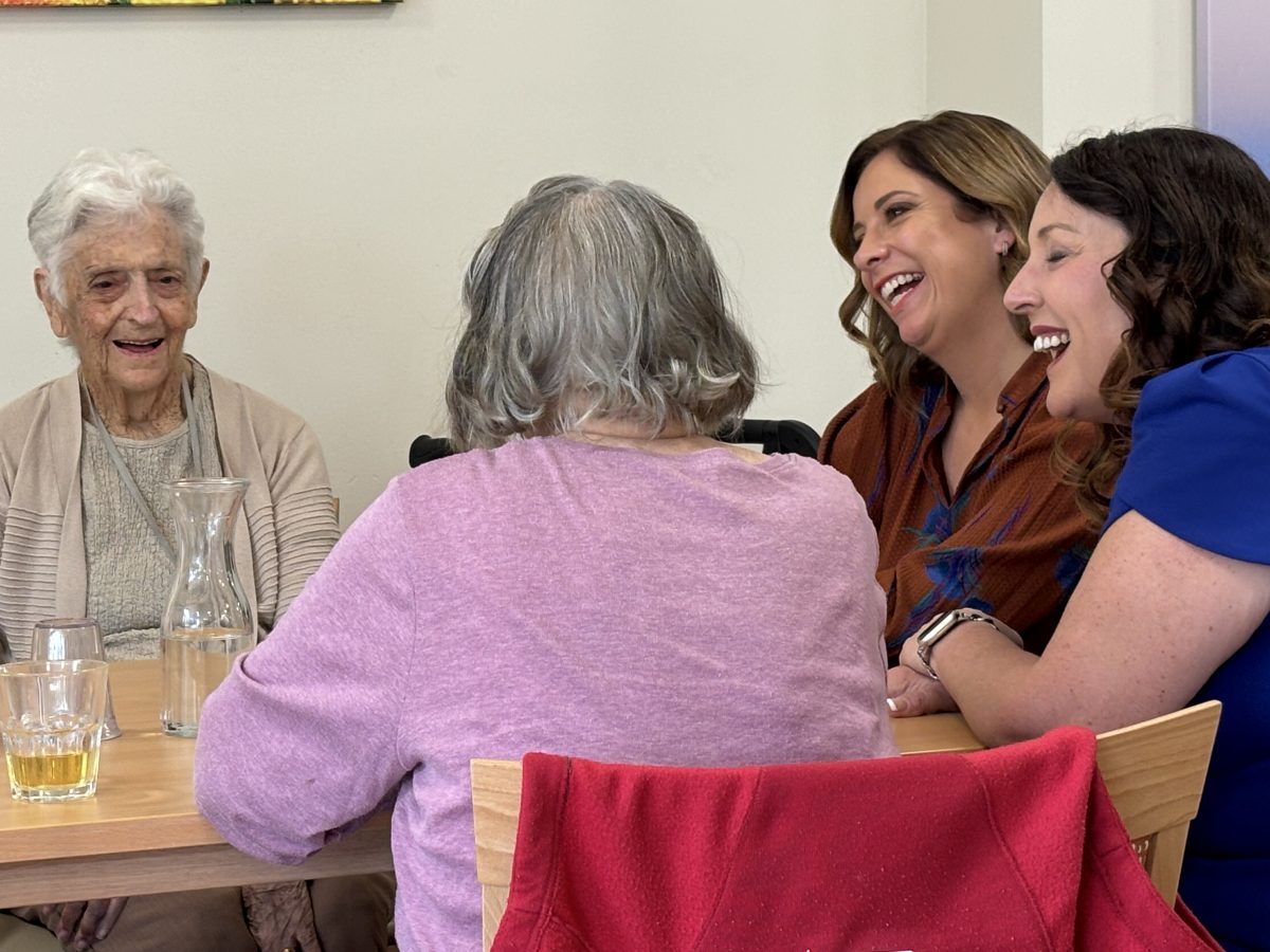 Group of women, two laughing