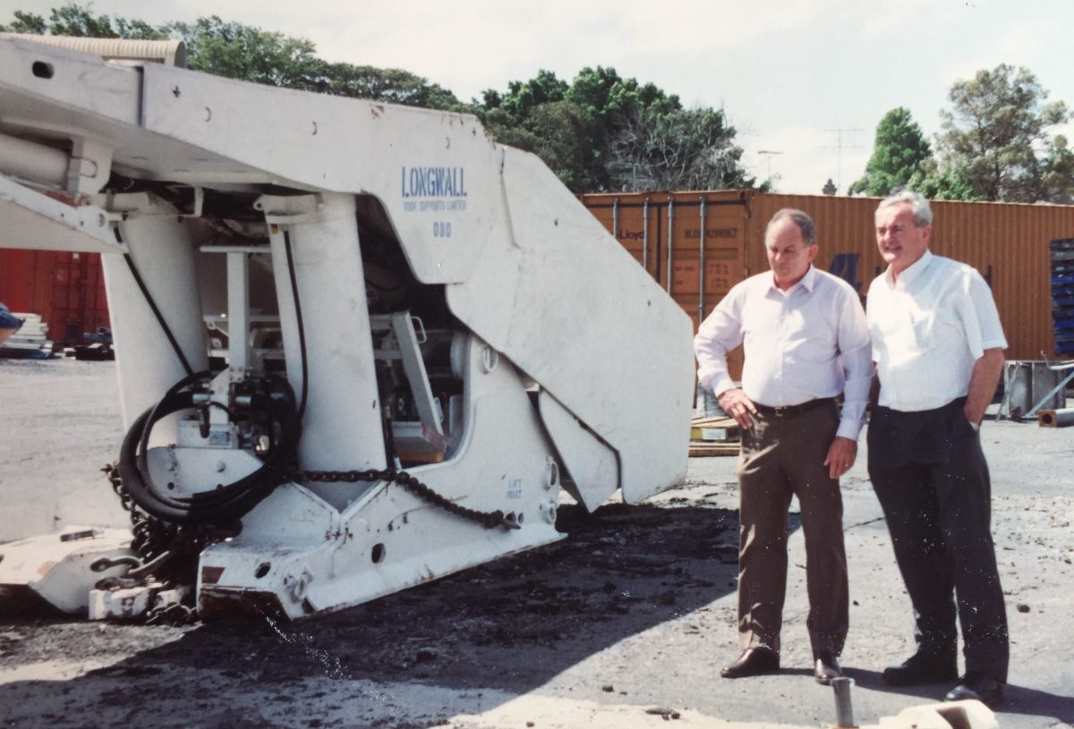 Two men looking at machinery