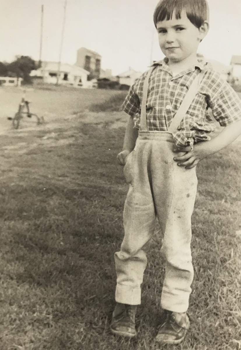 Young boy in overalls