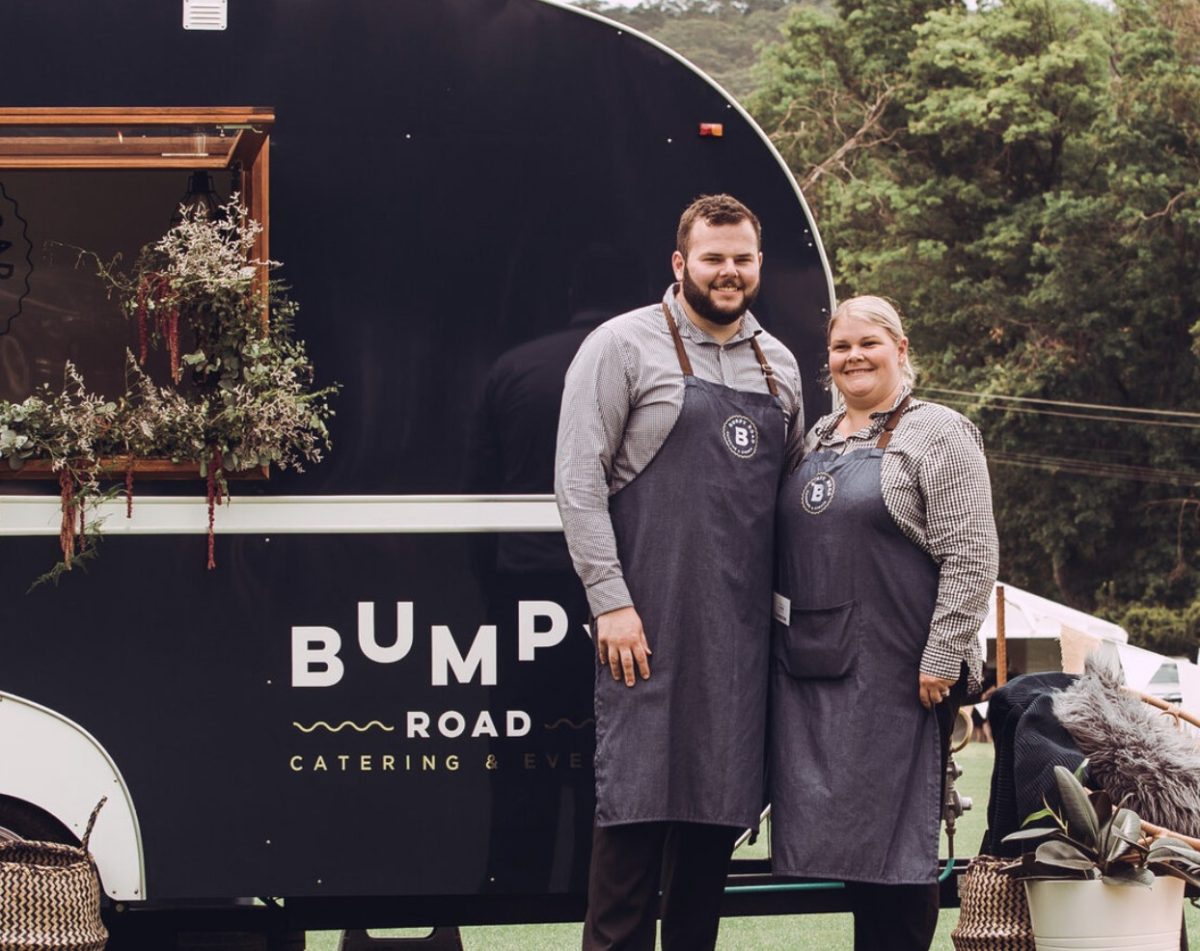 Jack and Alyce Dinnie in front of a Bumpy Road Catering and Events food truck