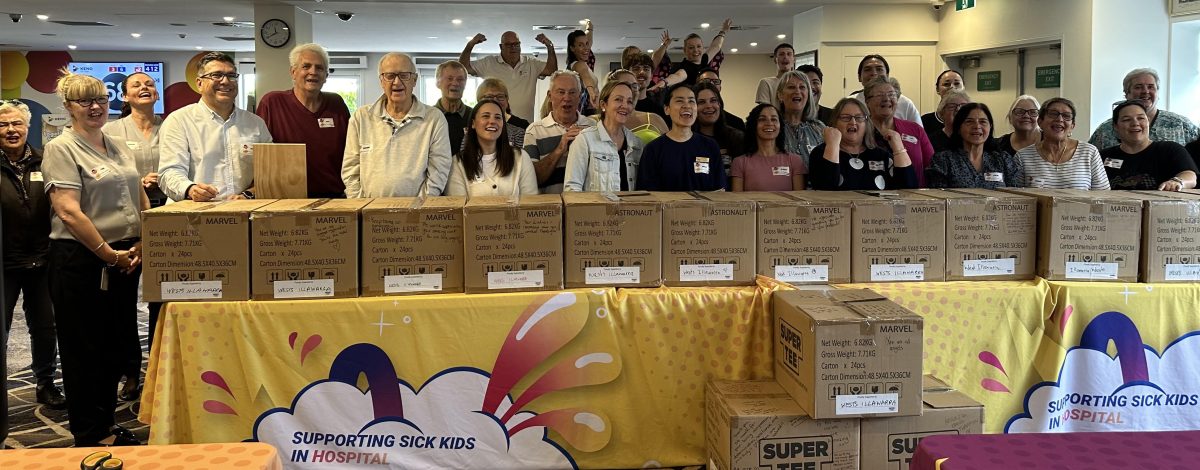 Group of people behind large boxes.