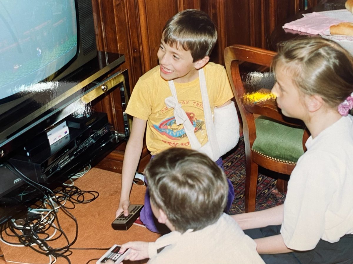 Old photo of children playing with a Nintendo