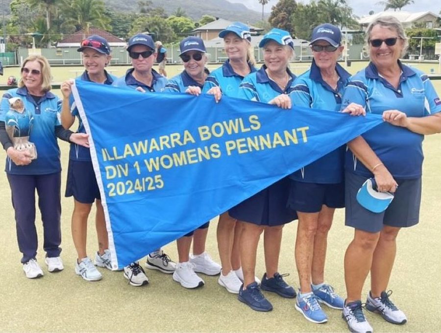 Women bowlers holding big flag.