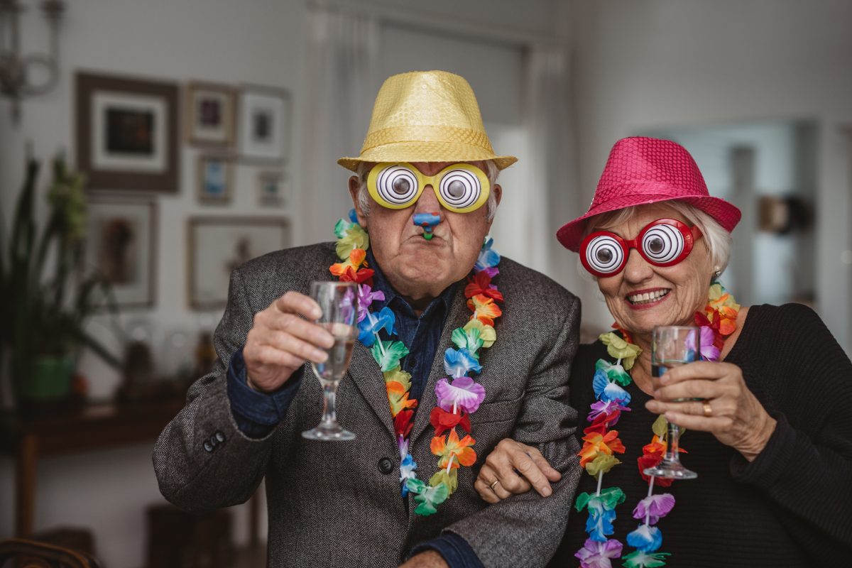 Old couple in party gear