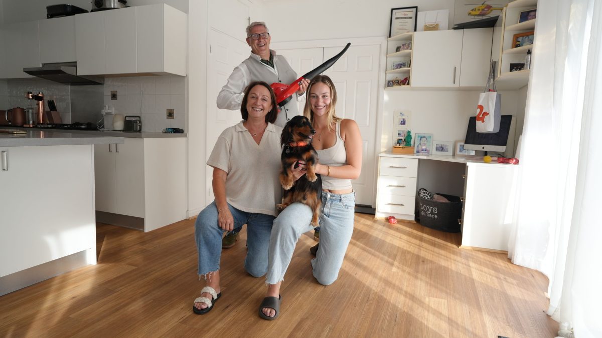 British dog trainer, podcaster and author Graeme Hall with two people and their dog