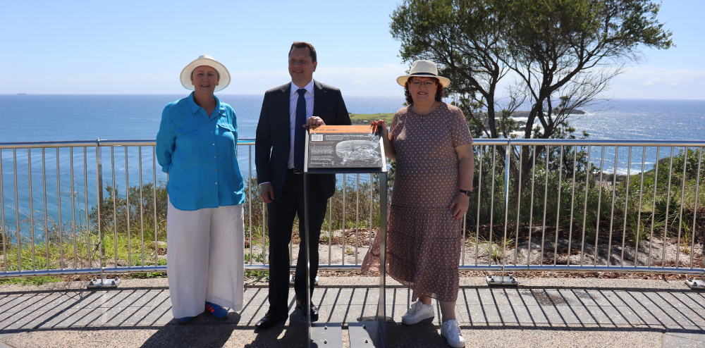 Three people at a lookout.