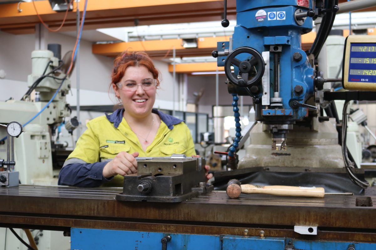 Woman at milling machine.