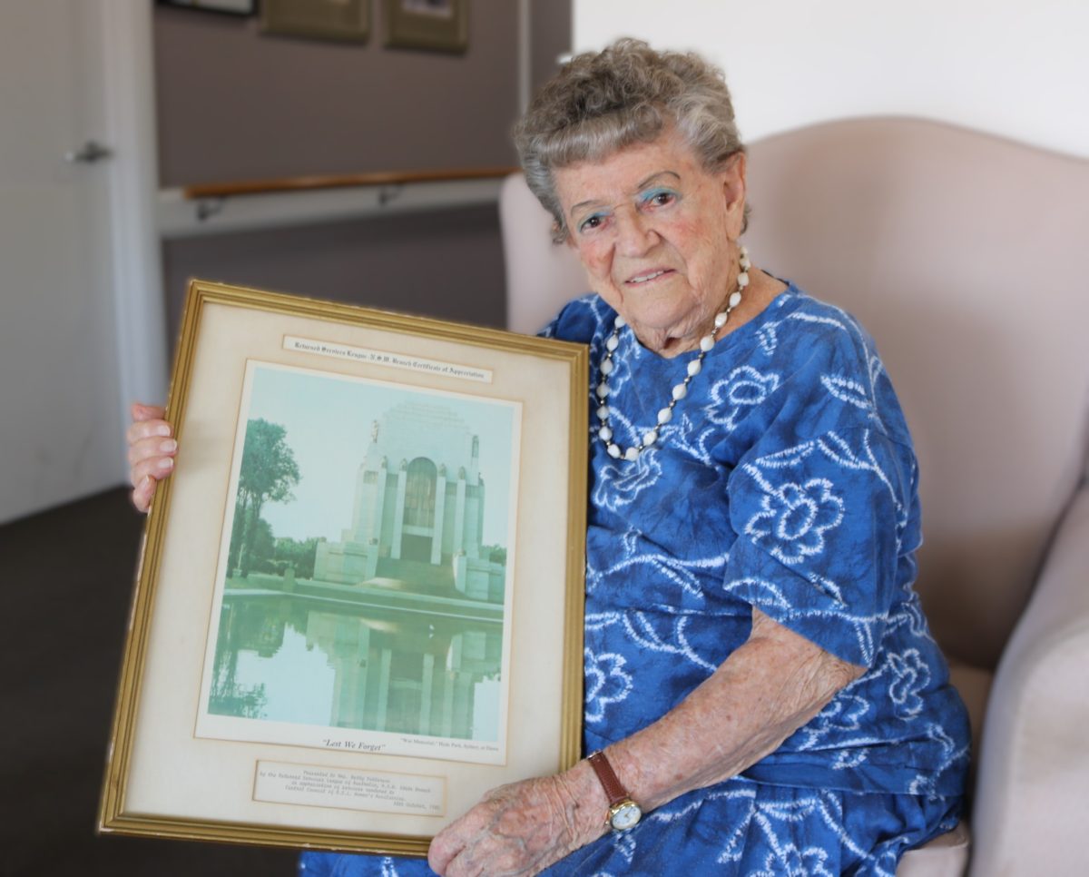 Woman holding a framed picture