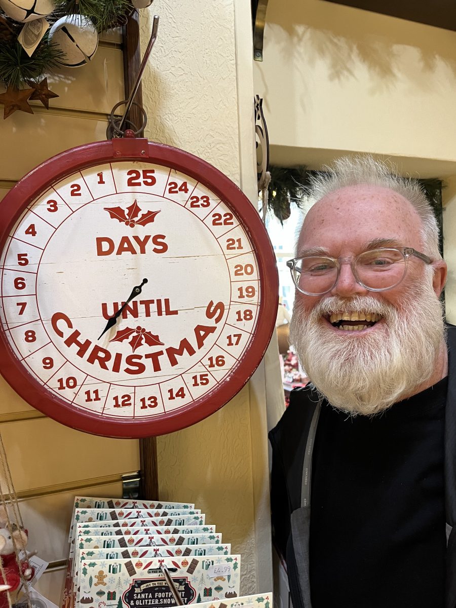 man with a Christmas clock