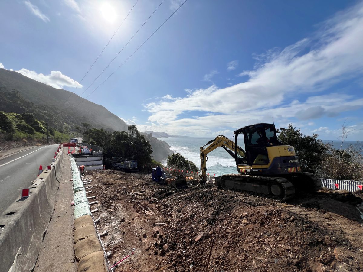 Excavator working along Lawrence Hargrave Drive near Sea Cliff Bridge. 