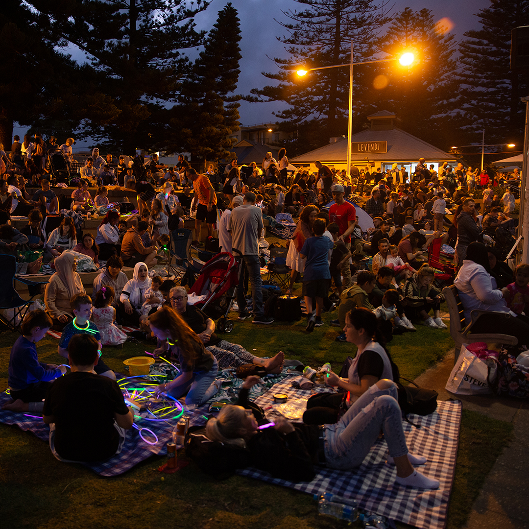 Crowd of people outside at night