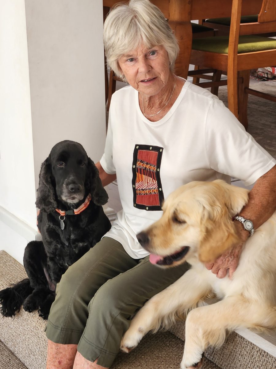 a woman with two dogs