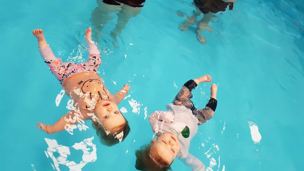 Two toddlers floating. 