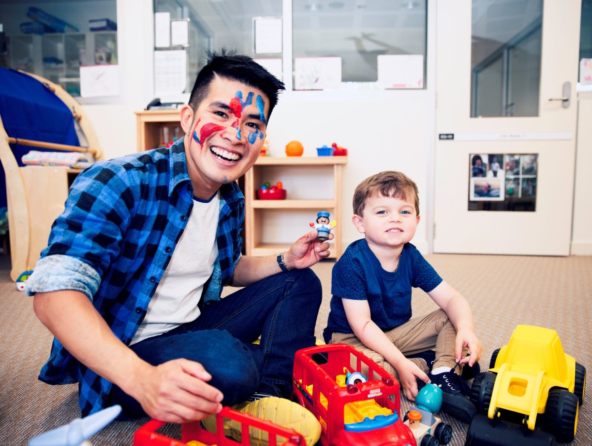 Early childhood educator with child. 