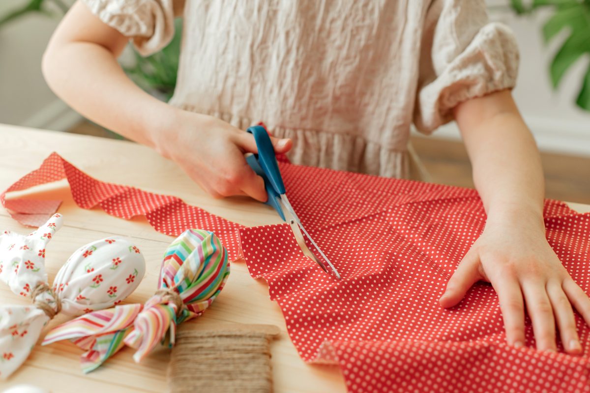 Person cuts fabric