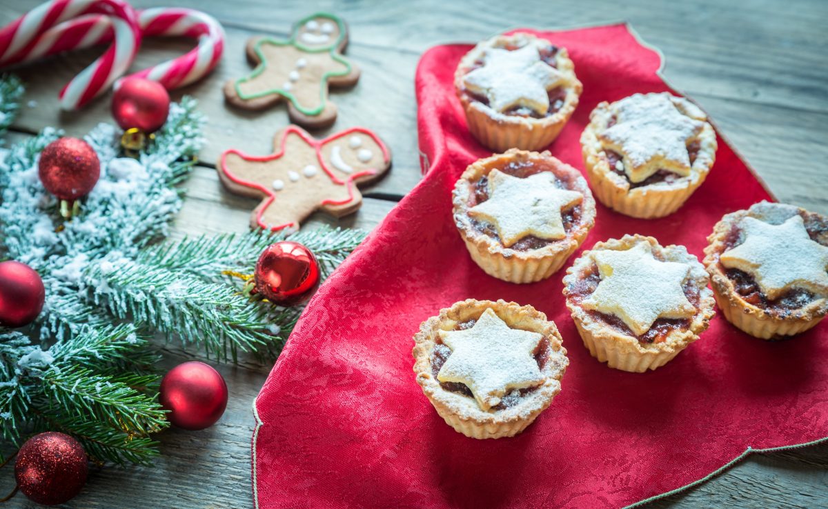 Decorated Christmas tree branch with holiday pastries