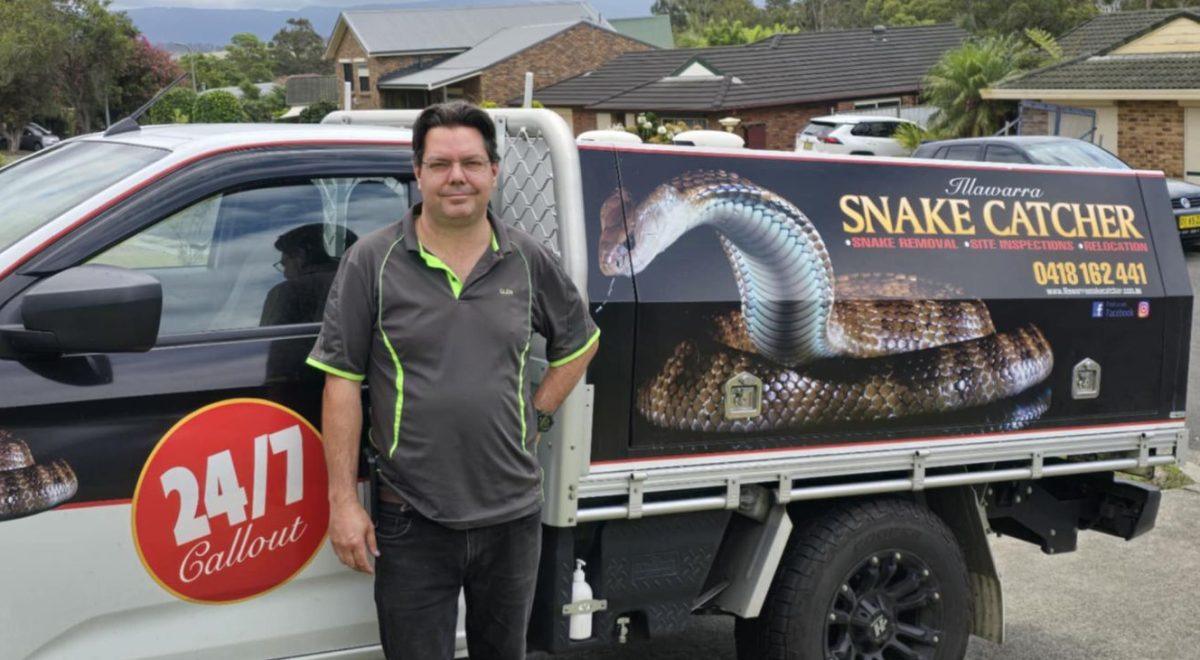 Man standing in front of van