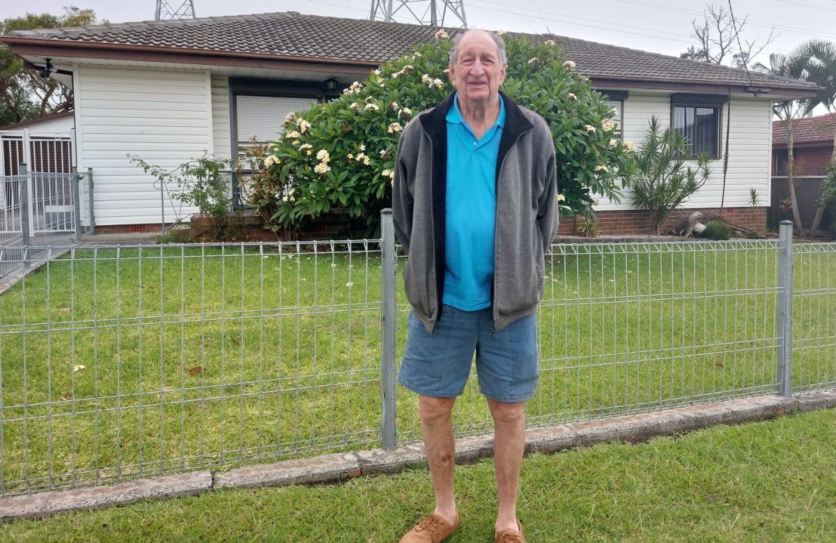 Man in front of house