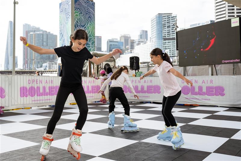 Kids skating in an open-air skating rink