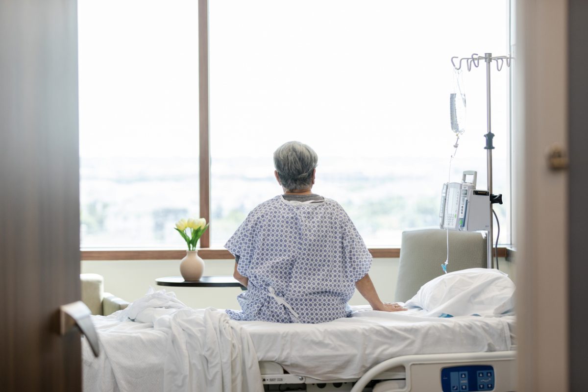 Woman sitting on hospital bed