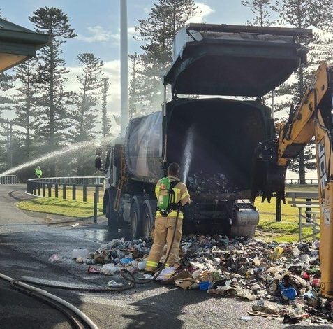 Garbage truck fire being extinguished