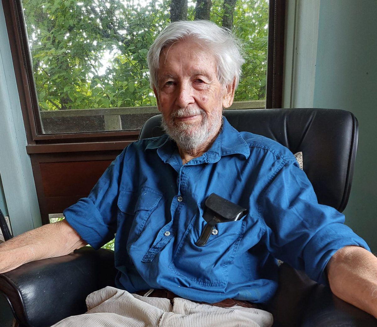 Man sitting in lounge chair.