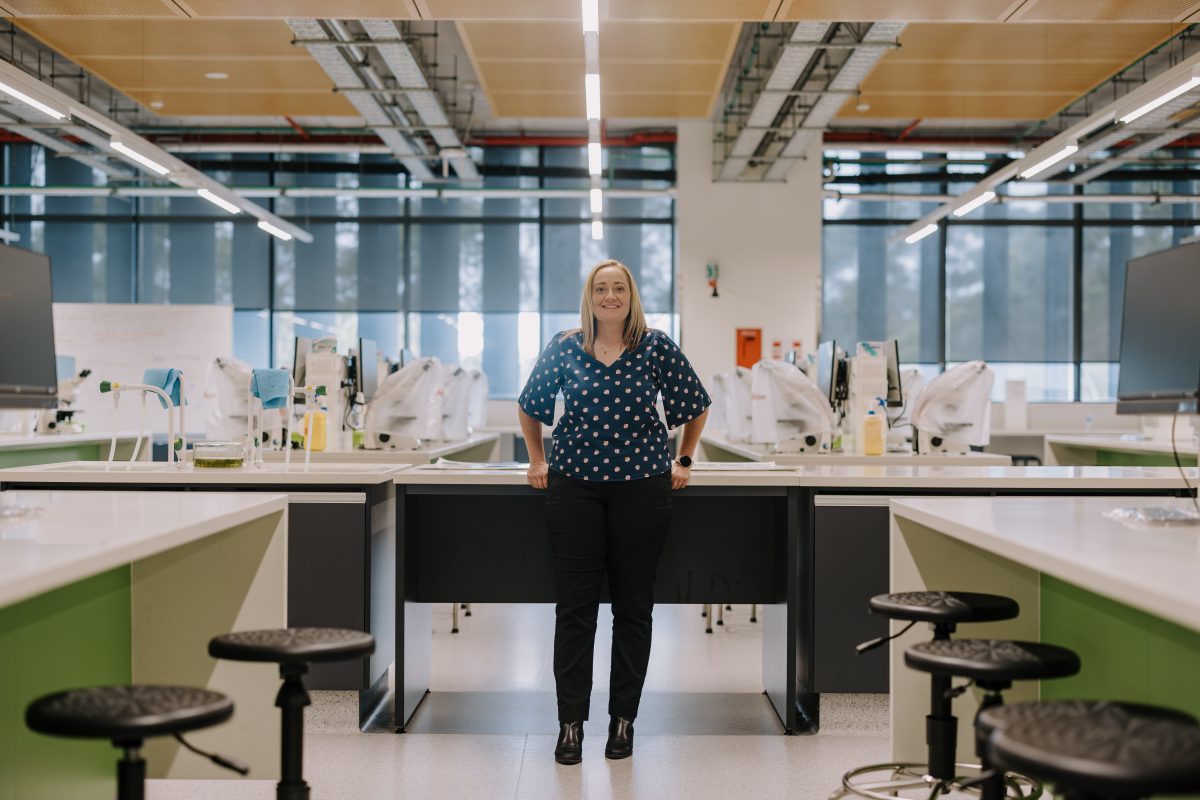 a woman standing in a uni lab