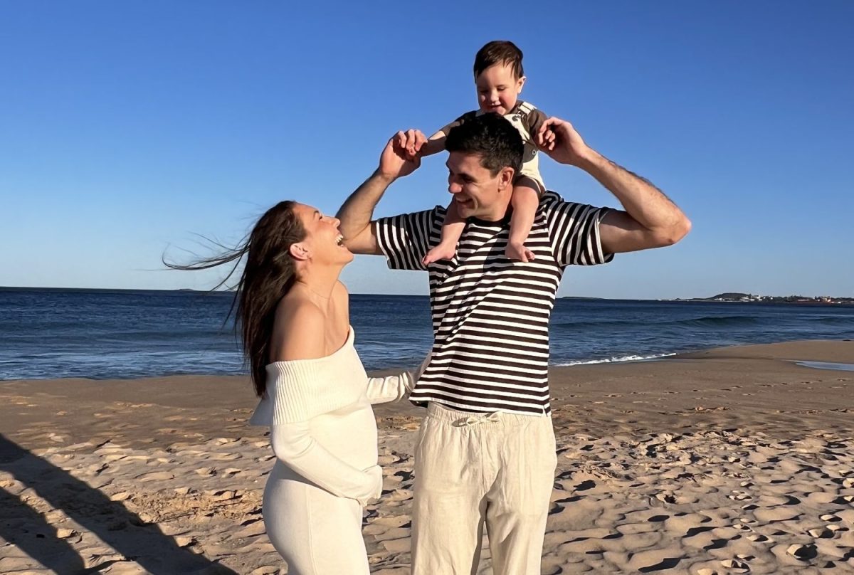 Man, woman and child on beach